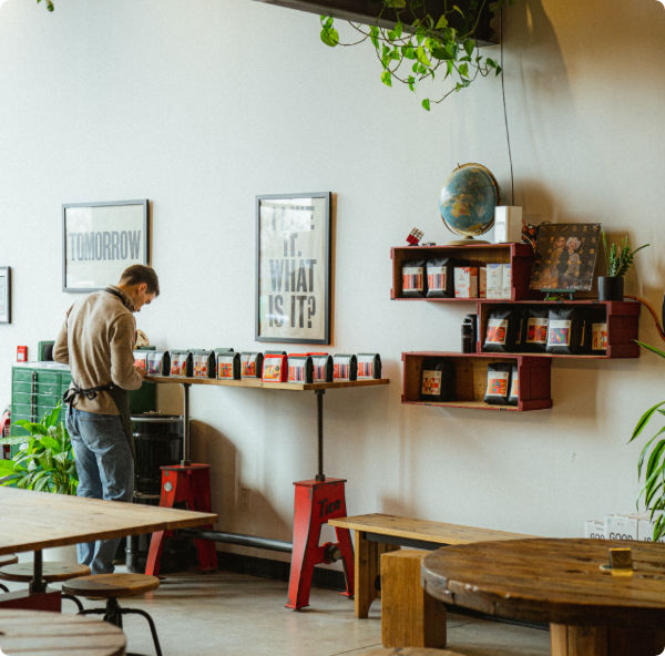 person looking at a display of specialty coffee